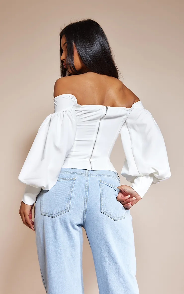 Top style corset blanc à col bardot et manches ballon